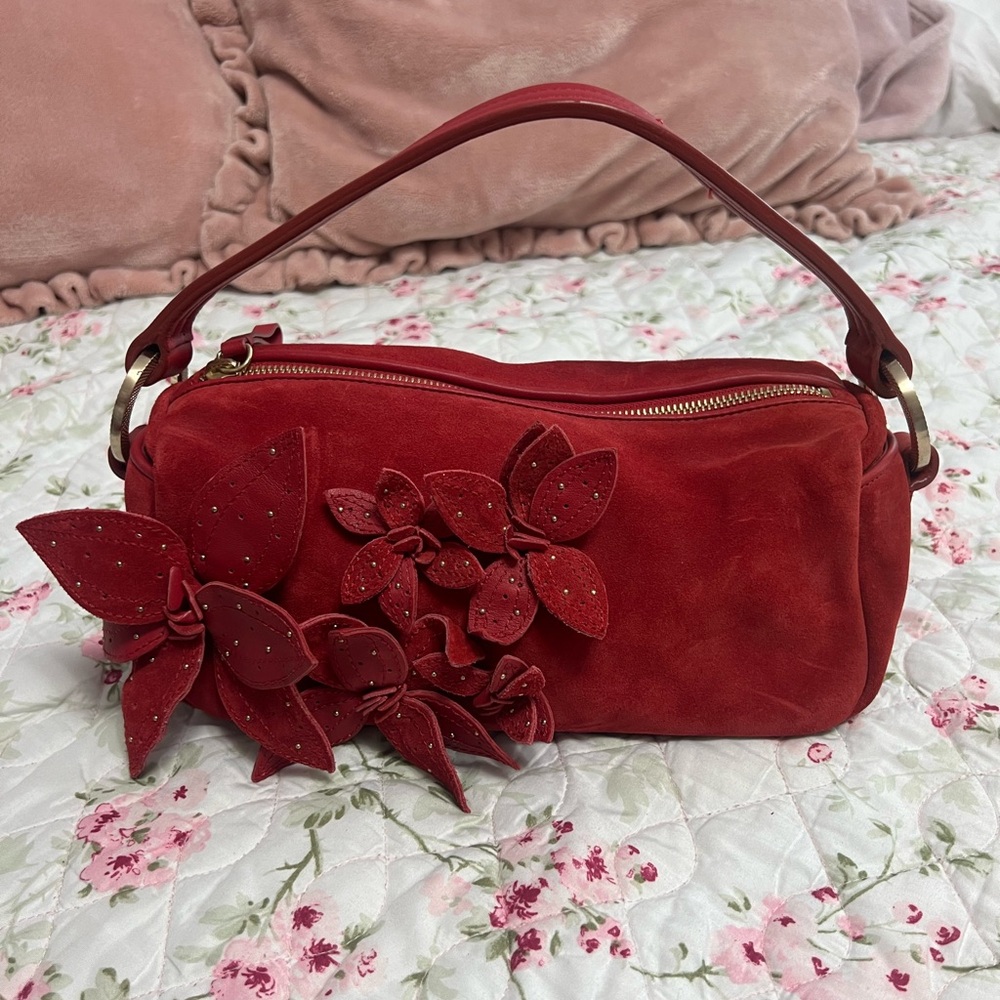 Red floral suede handbag